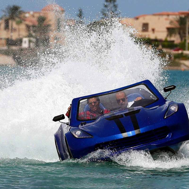 a man riding a wave on top of a body of water